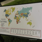 Panel displaying world map and community origins